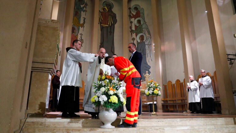 Hungarian triathlon champion Akos Vanek, who works with Covid-19 patients, gets baptized at Easter
