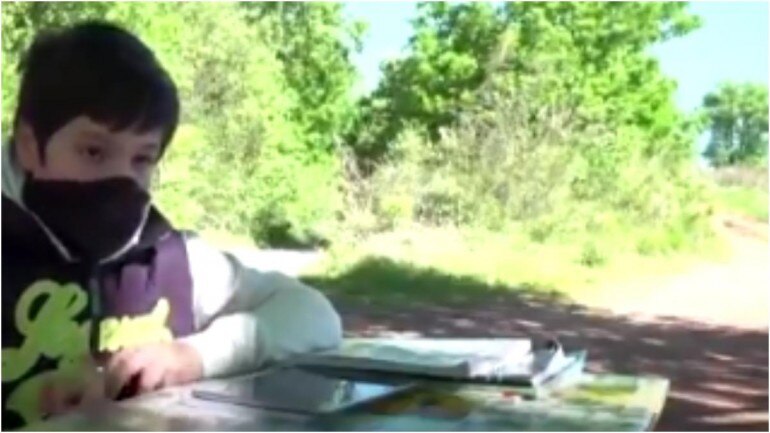 Giulio Giovanni travelled a mile for internet signal to study under a tree. (Photo: Reuters) Giulio Giovanni travelled a mile for internet signal to study under a tree. (Photo: Reuters)