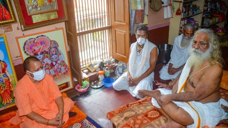UP CM Yogi Adityanath and Shri Ram Janmabhoomi Teerth Kshetra Trust president Mahant Nritya Gopal Das