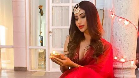 Mouni Roy in red ethnics with diya is a solid Diwali pic. Fans say