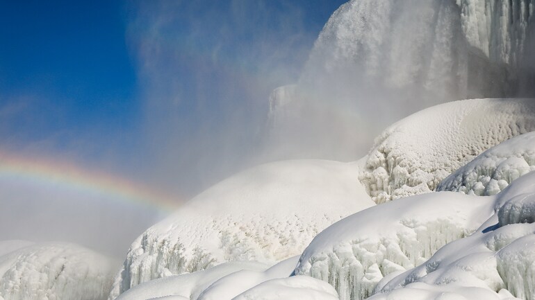 Rainbow appears over the skyline as Niagara Falls freezes. (Photo: Reuters)  Rainbow appears over the skyline as Niagara Falls freezes. (Photo: Reuters)
