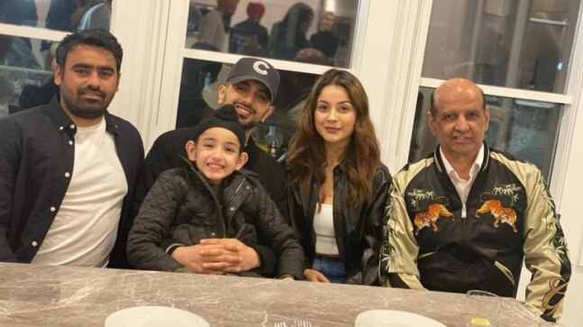 Shehnaaz Gill poses in black jacket with the team of Honsla Rakh in Canada. See pics