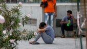 Family members of deceased Covid-19 patients mourn the death of their loved ones at the Civil Hospital in Ahmedabad on Thursday