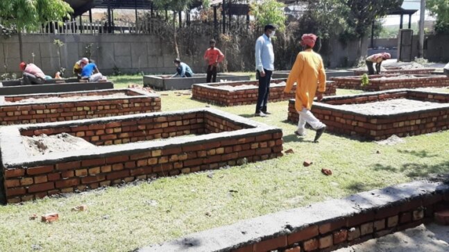 Delhi crematorium builds 70 pyres on field to cope with number of daily deaths
