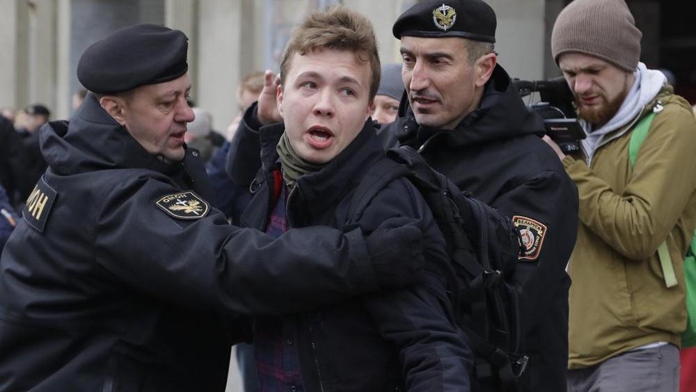 File photo of the Belarusian police arresting journalist Raman Pratasevich