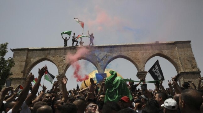 Palestinians see victory in Gaza truce as Israel warns Hamas