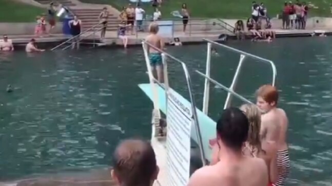Strangers cheer for boy who was scared to jump into a pool. Here's what happened next