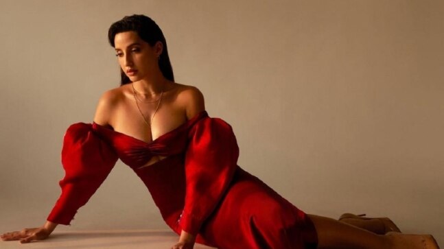 Nora Fatehi looks enchanting in Rs 51k red off-shoulder satin gown. See pics