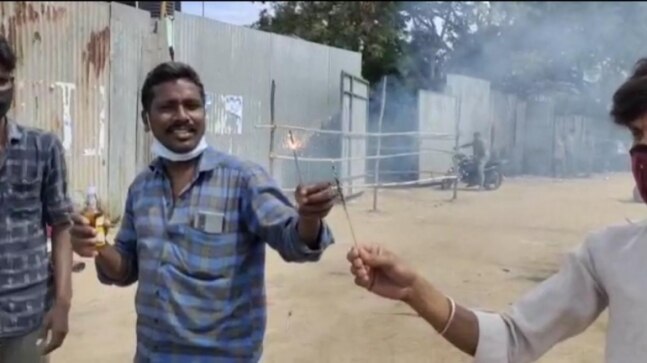 People burst crackers to celebrate reopening of liquor shops in Tamil Nadu's Coimbatore