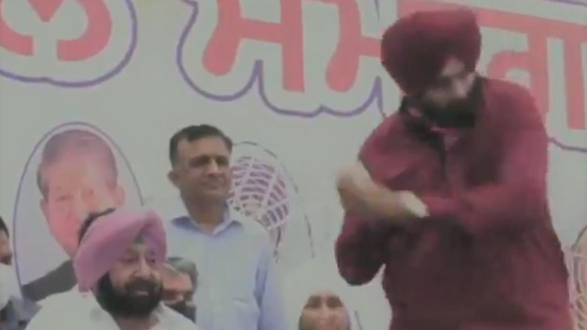 Sidhu hits a sixer as he takes charge of Punjab Congress, CM Amarinder Singh looks on: Watch