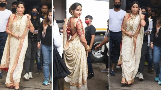 Nora Fatehi in laal paad shada saree and gold jewellery is at her traditional best. See pics