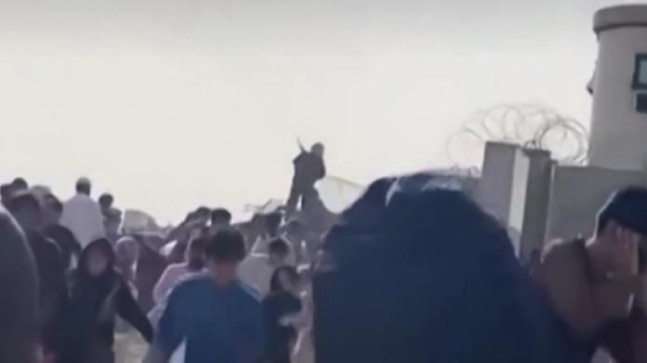 Taliban soldiers fire gunshots into air at Kabul airport to disperse crowds | Video