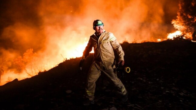 Thousands flee in Greece as wildfires sweep through Mediterranean