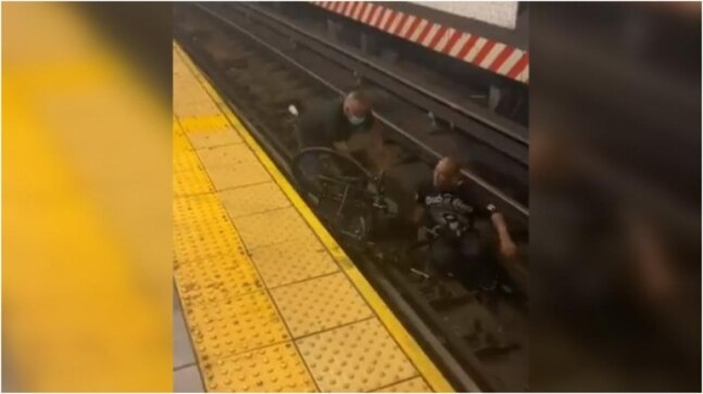 Wheelchair-bound man falls on New York subway train tracks. Viral video shows what happened next