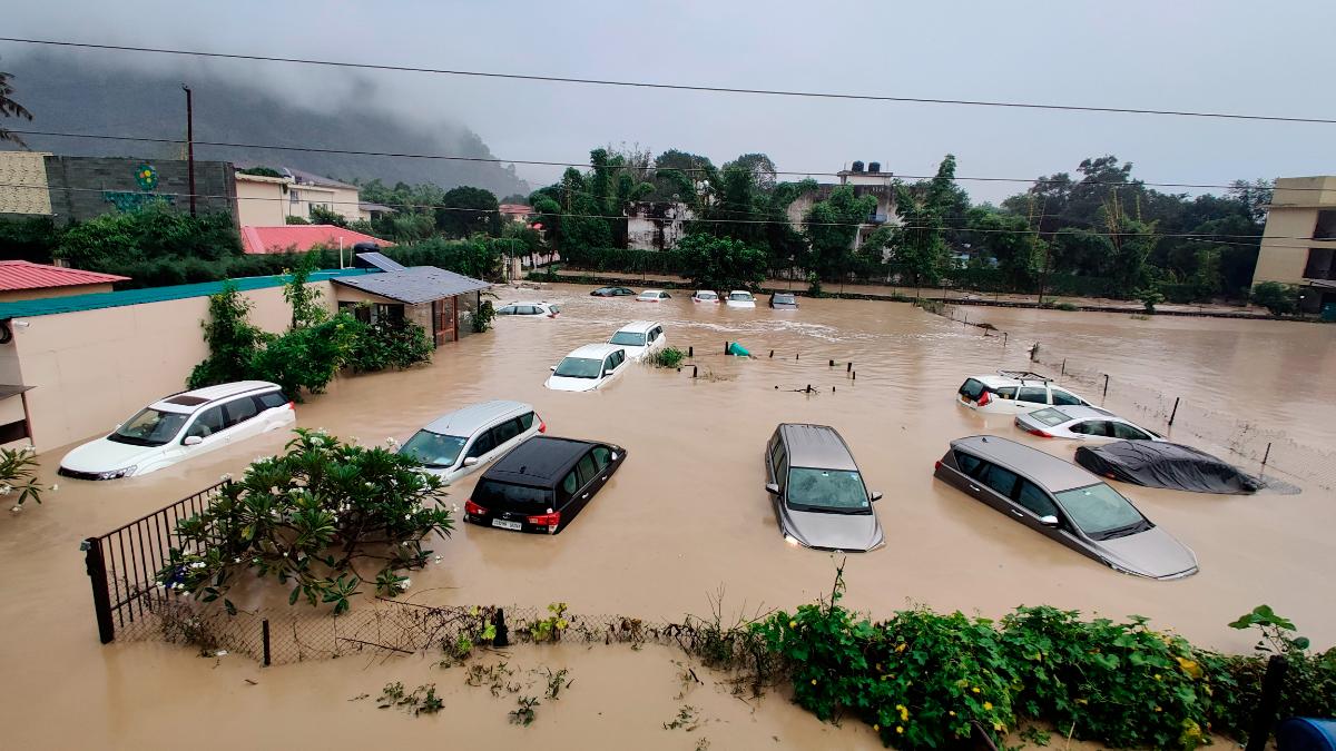 Sunken cars in a flooded resort in Uttarakhand on Tuesday