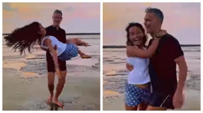 Ankita Konwar and Milind Soman share loved-up moments on the beachside. Watch