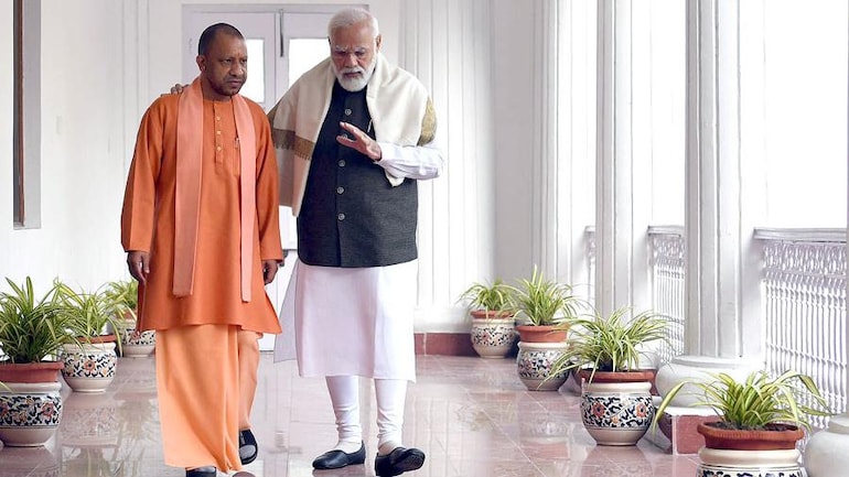 Opposition reacts to UP CM Yogi Adityanath's pic with PM Modi - India News