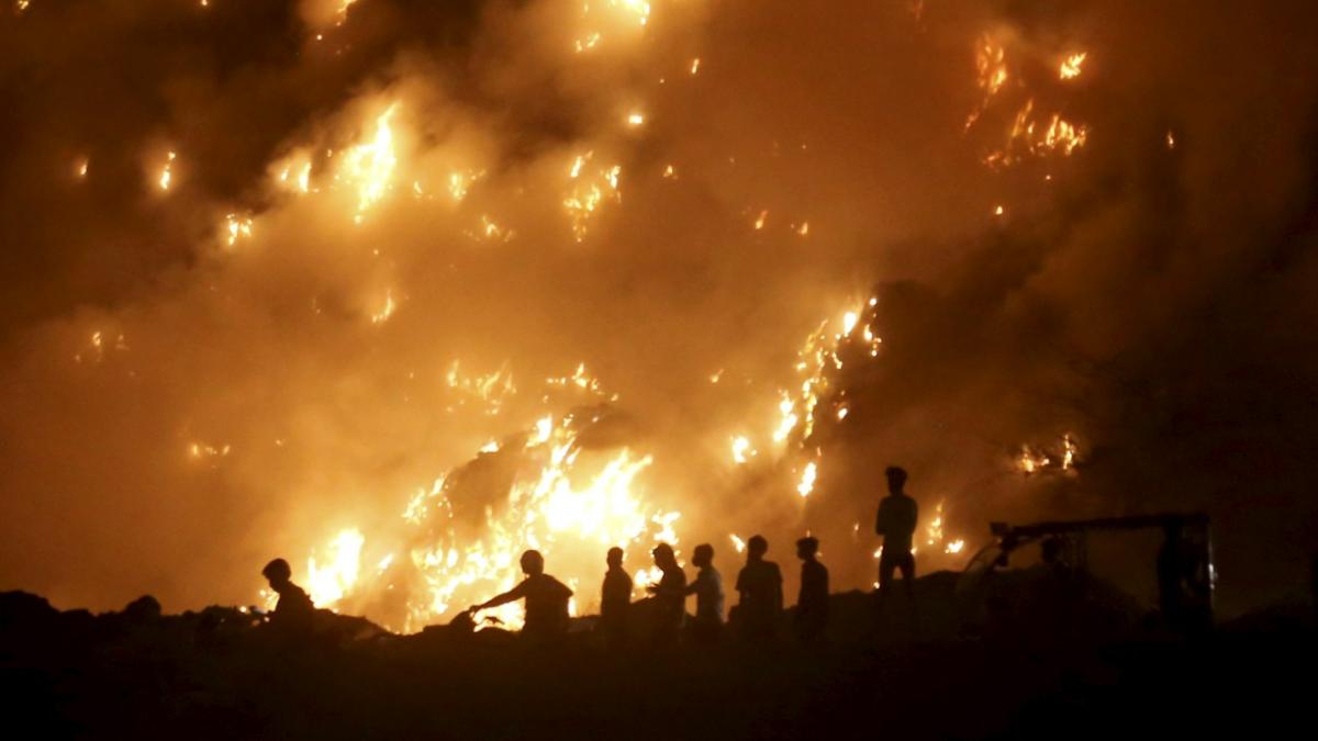 A massive fire which broke out at the Bhalswa landfill site in north Delhi, Tuesday, April 26, 2022. 