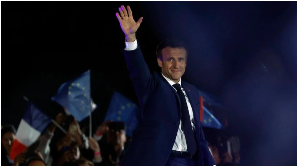 French President Emmanuel Macron waves on stage, after being re-elected as president. (Photo: Reuters) French President Emmanuel Macron waves on stage, after being re-elected as president. (Photo: Reuters)
