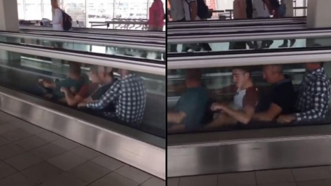 Video of 4 men rowing on a moving walkway at the airport has gone viral. Watch