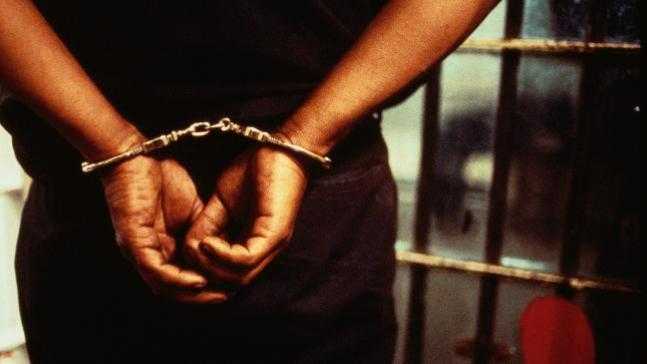 Representative image of accused being arrested wearing handcuffs