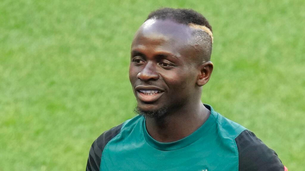 Liverpool forward Sadio Mane becomes Senegal's all-time top scorer with a hat-trick against Benin 