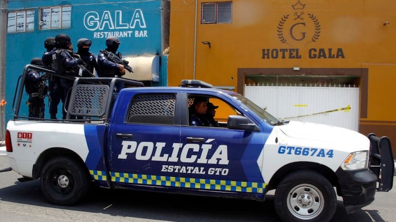 Police outside the Bar and Hotel Gala where 11 people were murdered in Celaya, Guanajuato State, Mexico in May 2022: another shooting in Guanajuato state has killed five high school students, police said. Police outside the Bar and Hotel Gala where 11 people were murdered in Celaya, Guanajuato State, Mexico in May 2022: another shooting in Guanajuato state has killed five high school students, police said.