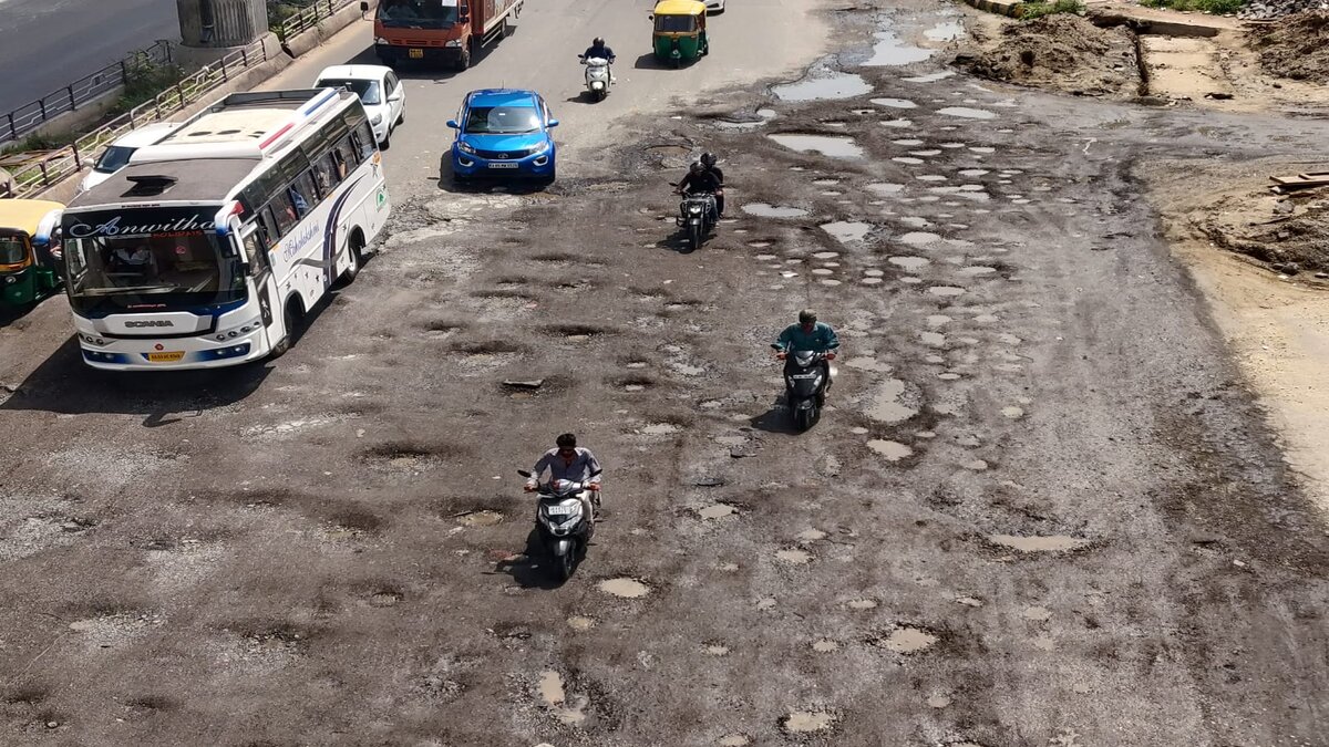 Bengaluru roads ridden with potholes, repair work still underway