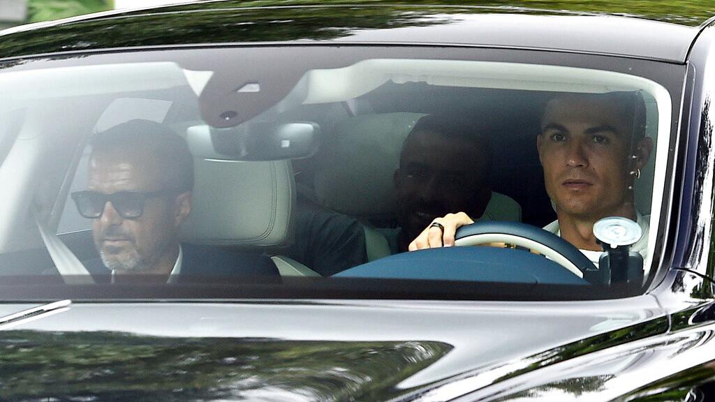 Cristiano Ronaldo and his agent Jorge Mendes while entering Manchester United's training base