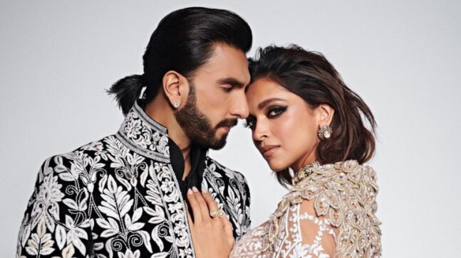 Deepika Padukone gets a kiss from Ranveer Singh as they walk the ramp together for the first time. Watch