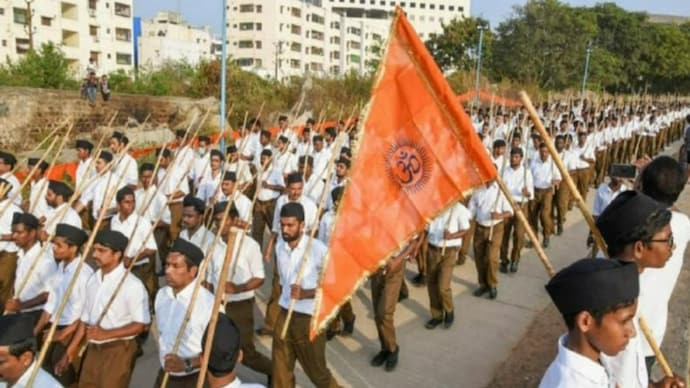 RSS workers march holding saffron flags