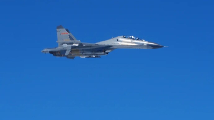 A Chinese PLA J-11 fighter jet, as seen from the US Navy P-8A reconnaissance jet over the South China Sea on Friday.
