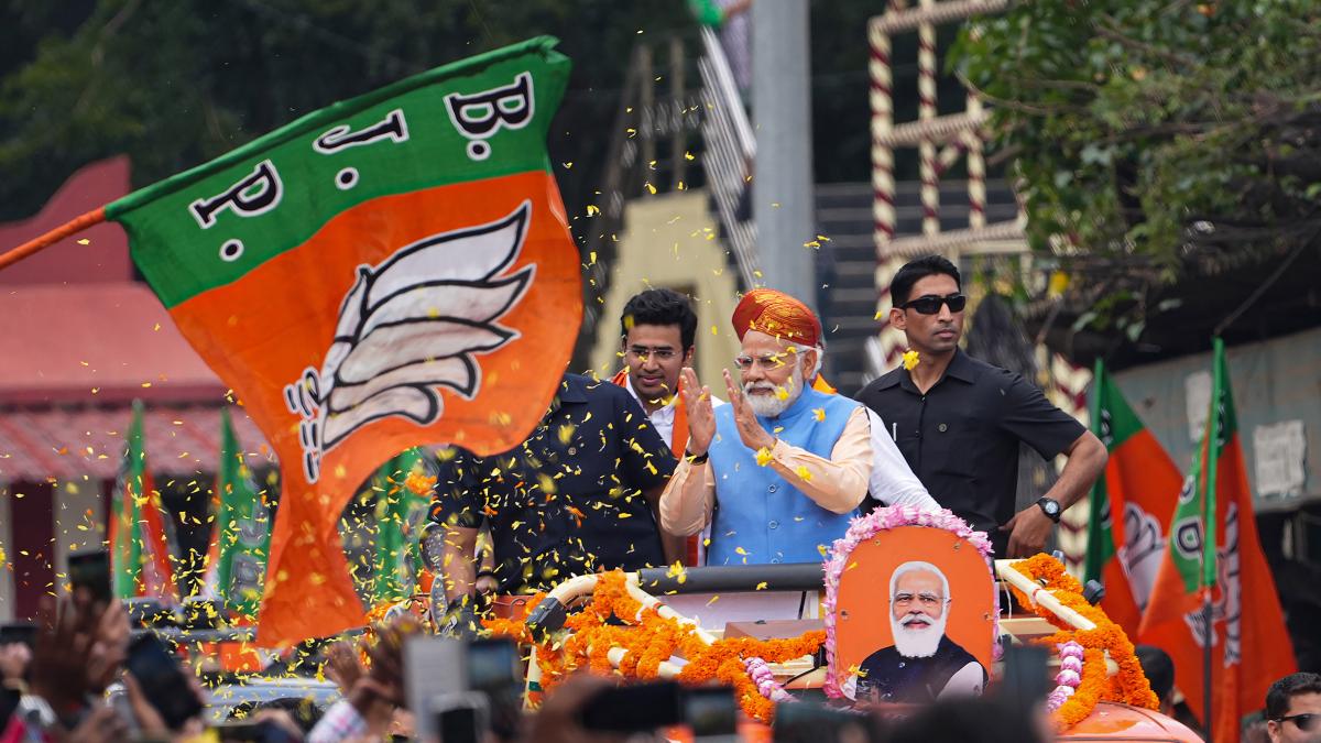 PM Modi during a roadshow in Bengaluru ahead of Karnataka Assembly polls. (PTI Photo)