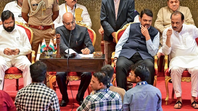 A NEW DEPUTY CM: Shinde, governor Ramesh Bais and Fadnavis at Ajit Pawar’s swearing-in ceremony, July 2 (Photo: Getty Images)