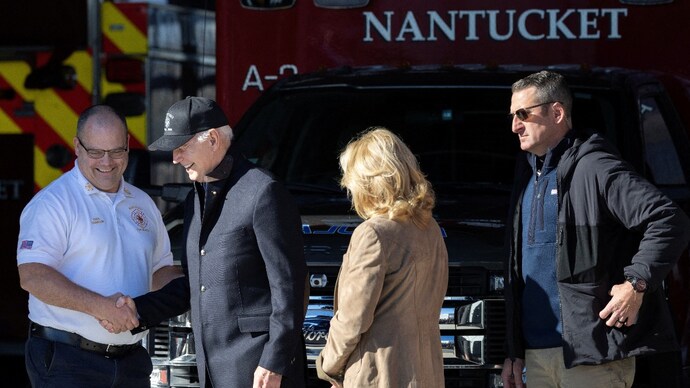 US President Joe Biden greets Nantucket Fire Department Chief Cranson alongside First Lady Jill Biden, at the Nantucket Fire Department in Nantucket, Massachusetts. (Photo: Reuters)