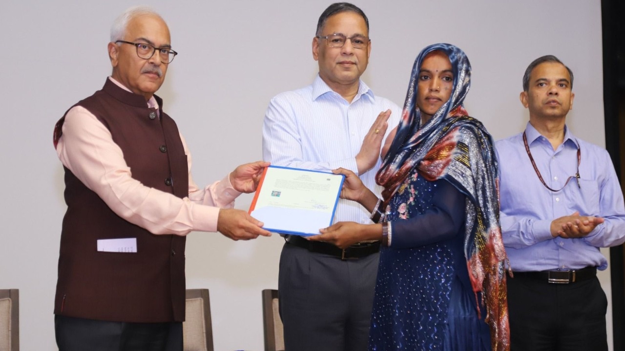 Union Home Secretary Ajay Kumar Bhalla handing over citizenship certificate under CAA. 