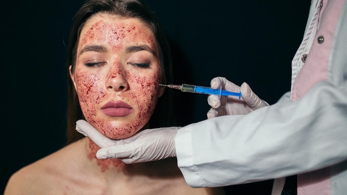 Portrait of a young woman having an injection during her facial treatment