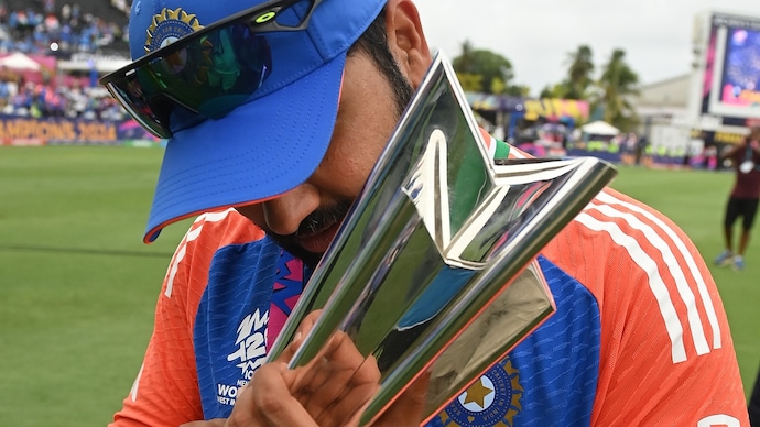Rohit was finally able to pose with the trophy (Courtesy: Getty)