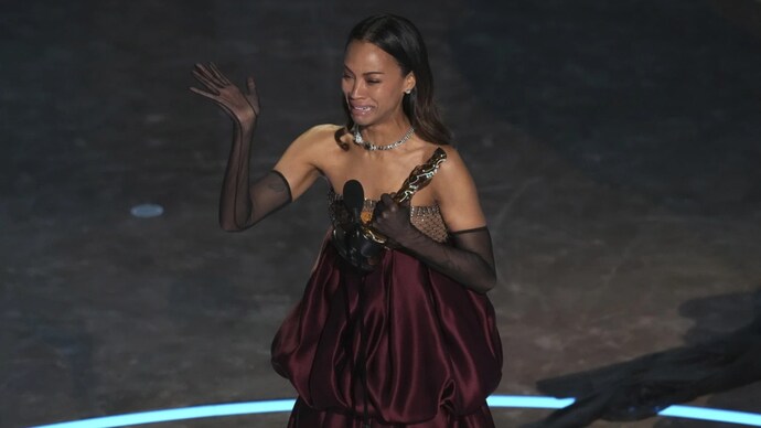 Zo Saladana talked about her immigrant roots at the 97th Academy Awards. (Photo Credit: AP)     A picture of emotional Zo Saladana.
