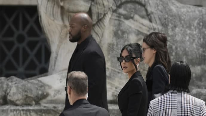 Kim Kardashian arrives to testify regarding a robbery of millions of dollars in jewels from her Paris hotel room in 2016