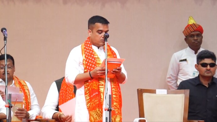 Home Minister Harsh Sanghvi taking oath as Deputy Chief Minister.
