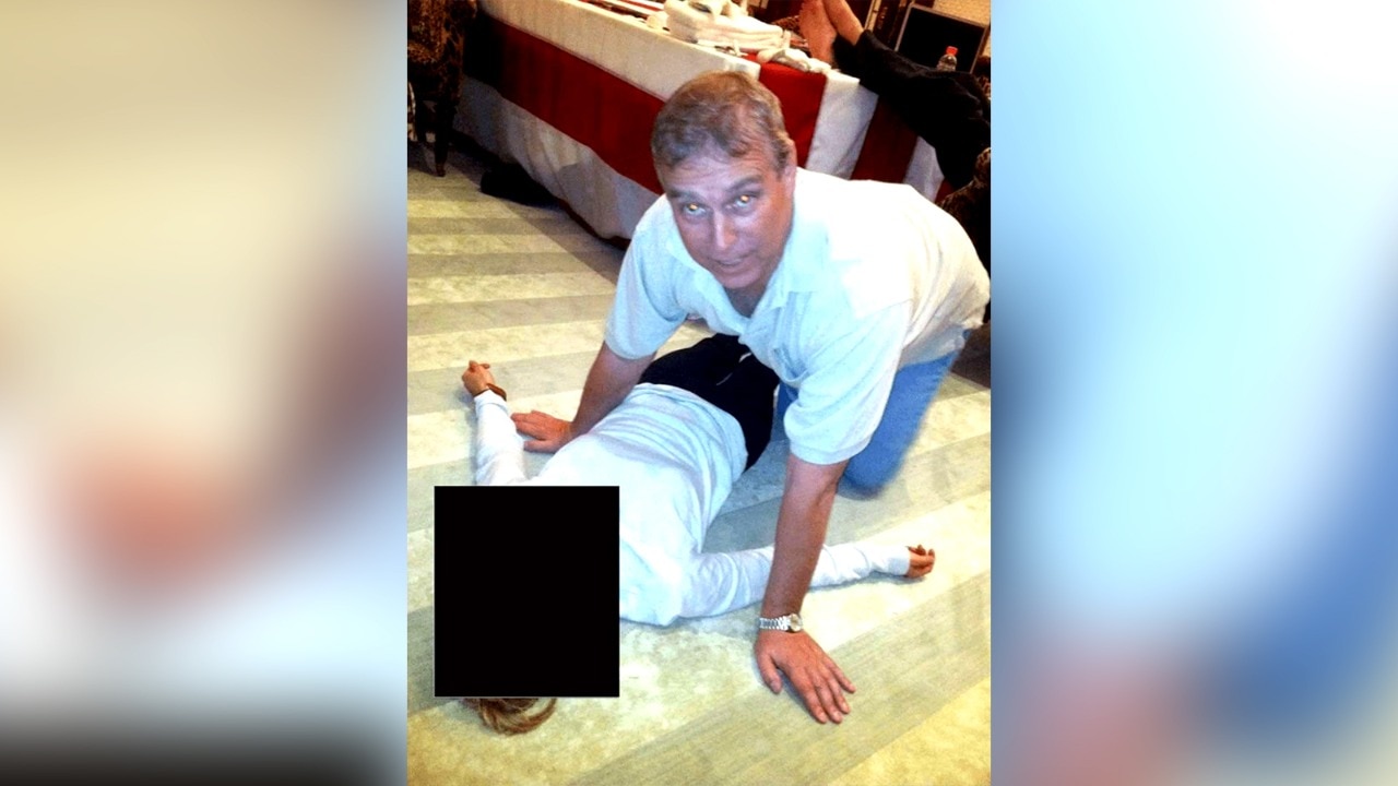Photos of ex-Prince Andrew crouching over woman in new Epstein files