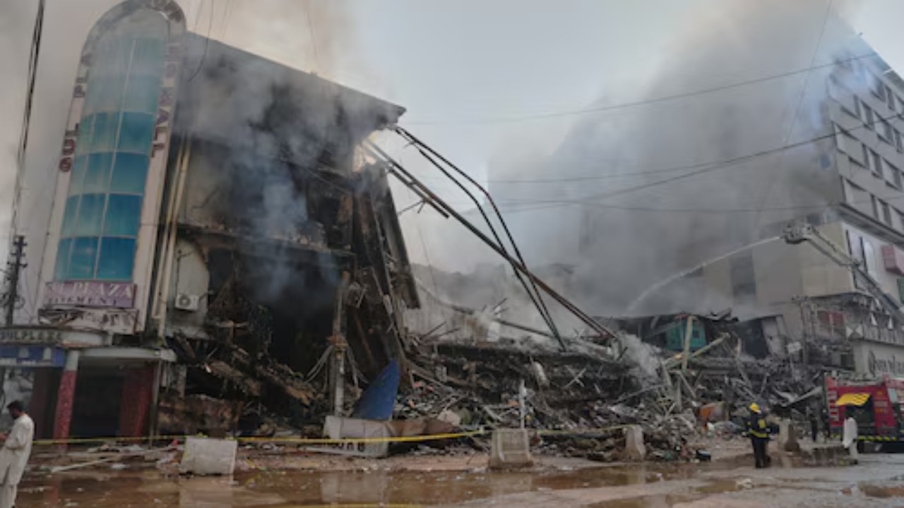 Firefighters search for 65 missing after Karachi shopping mall fire kills six