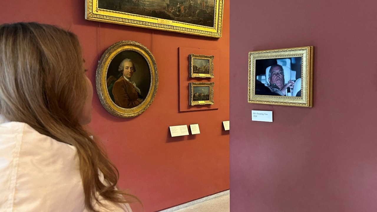 Video: Activists hang disgraced ex-royal Andrew's arrest photo in the Louvre