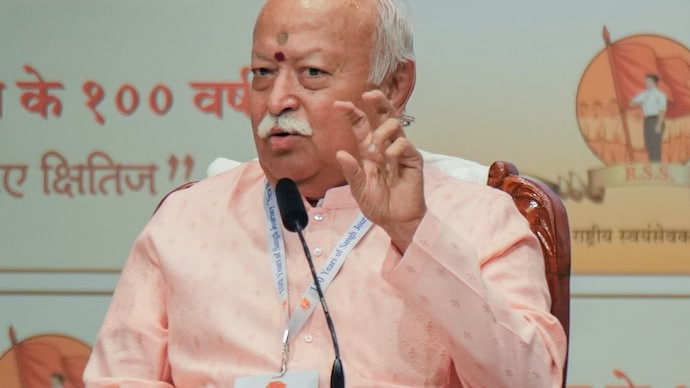 RSS chief Mohan Bhagwat addresses a gathering during the 'New Horizons' lecture series marking the organization's centenary year, in Mumbai. RSS chief Mohan Bhagwat addresses a gathering during the 'New Horizons' lecture series marking the organization's centenary year, in Mumbai,