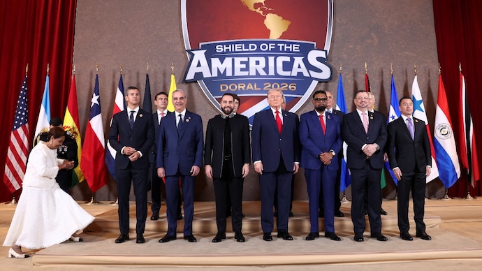 Reuters) US President Donald Trump and Latin American leaders pose for a family photo during the "Shield of the Americas" Summit in Miami