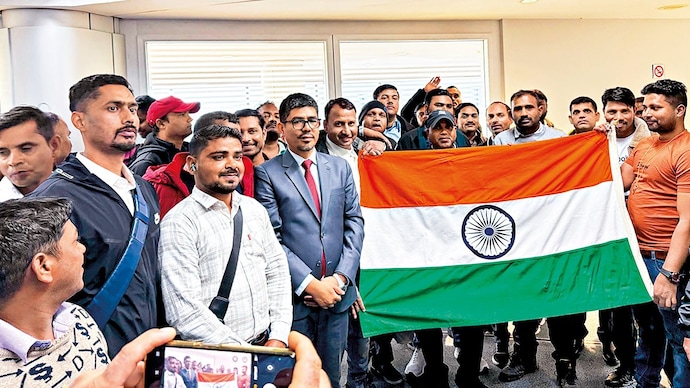 SAFE RETURN: Noor Rahman Sheikh, Indian ambassador to Lebanon, with Indian nationals departing for Delhi, Beirut, Mar. 11. (Photo: ANI)