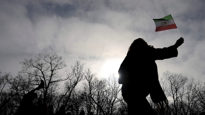 Reuters) Iranians celebrate