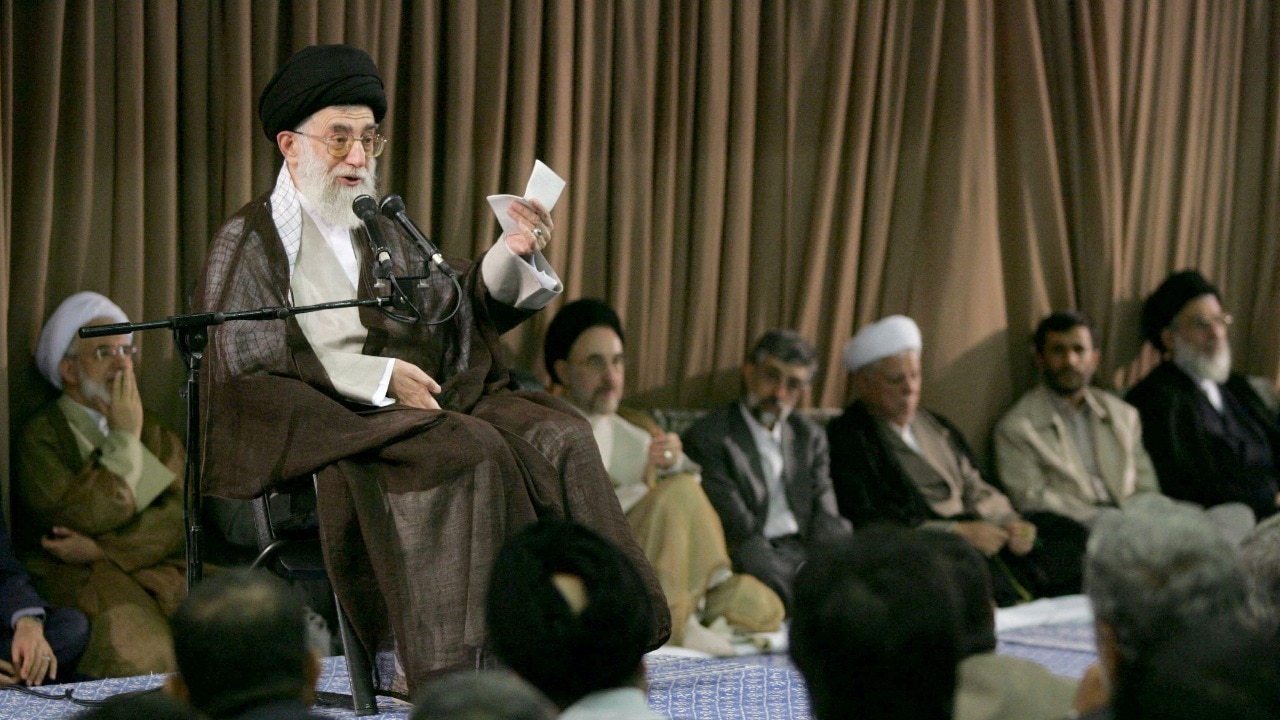 Who was Ali Khamenei, the cleric who held ultimate power in Iran since 1989?