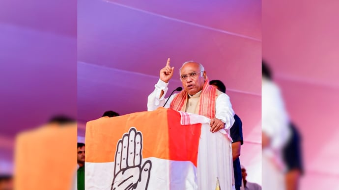 Congress President Mallikarjun Kharge addresses a public meeting ahead of the Assam Assembly elections, in Naoboicha. (AICC via PTI) Kharge